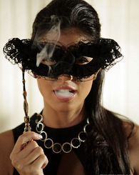 Smoking slut with a mask shows her big boobs and nice ass